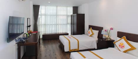 Deluxe Triple Room, 1 Bedroom, Non Smoking, City View | Minibar, desk, laptop workspace, blackout drapes