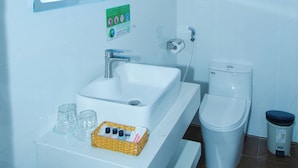 A modern bathroom with a white sink, mirror, and toilet. - The Rice Hotel & Tour - 40 Bui Vien No 9 (Ho Chi Minh City)