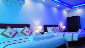 Premium Quadruple Room, 1 Bedroom, City View | Minibar, desk, laptop workspace, blackout drapes - The Rice Hotel & Tour - 40 Bui Vien No 9 (Ho Chi Minh City)