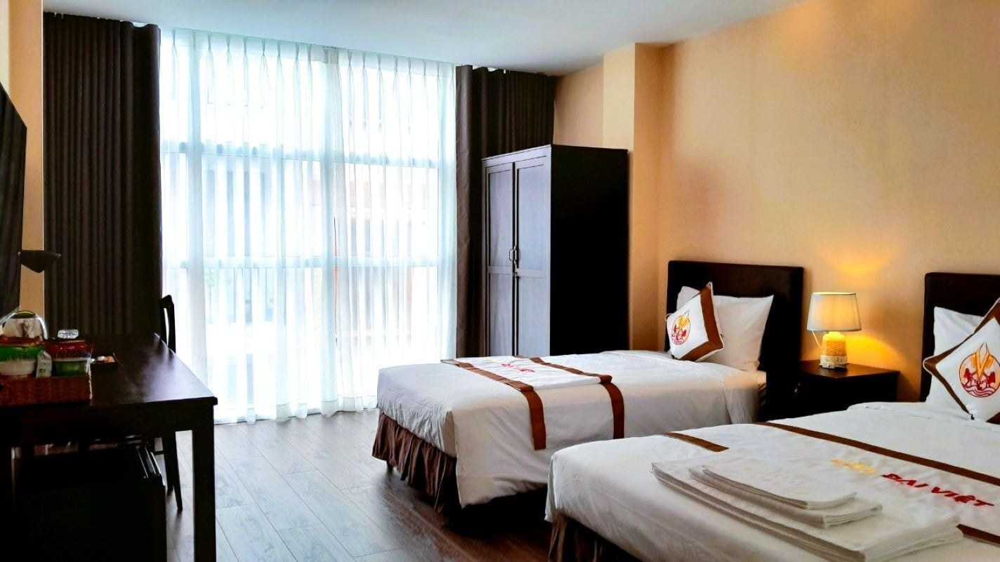 Deluxe Triple Room, 1 Bedroom, Non Smoking, City View | Minibar, desk, laptop workspace, blackout drapes
