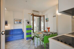 Family Apartment, Terrace | Private kitchen | Fridge, stovetop, griddle, cookware/dishes/utensils - Pineta Azzurra (Grosseto)
