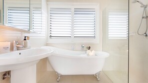 Bathtub, hair dryer, towels