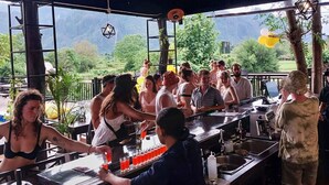 A bar area with a view of a mountainous landscape. - Mad Monkey  Vang Vieng (Vang Vieng)