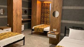 Family Quadruple Room | Minibar, in-room safe, desk, iron/ironing board