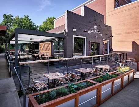 Outdoor dining. Historic NoDa Mill House • Steps to Shops & Dining