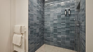 Shower, rainfall showerhead, hair dryer, towels