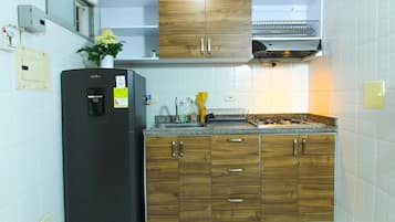 Family Studio | Private kitchen | Full-sized fridge, microwave, blender, griddle