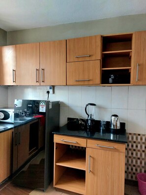 Fridge, microwave, oven, stovetop - 2 bedroom master ensuite in Kisumu,Kenya. (Kisumu)