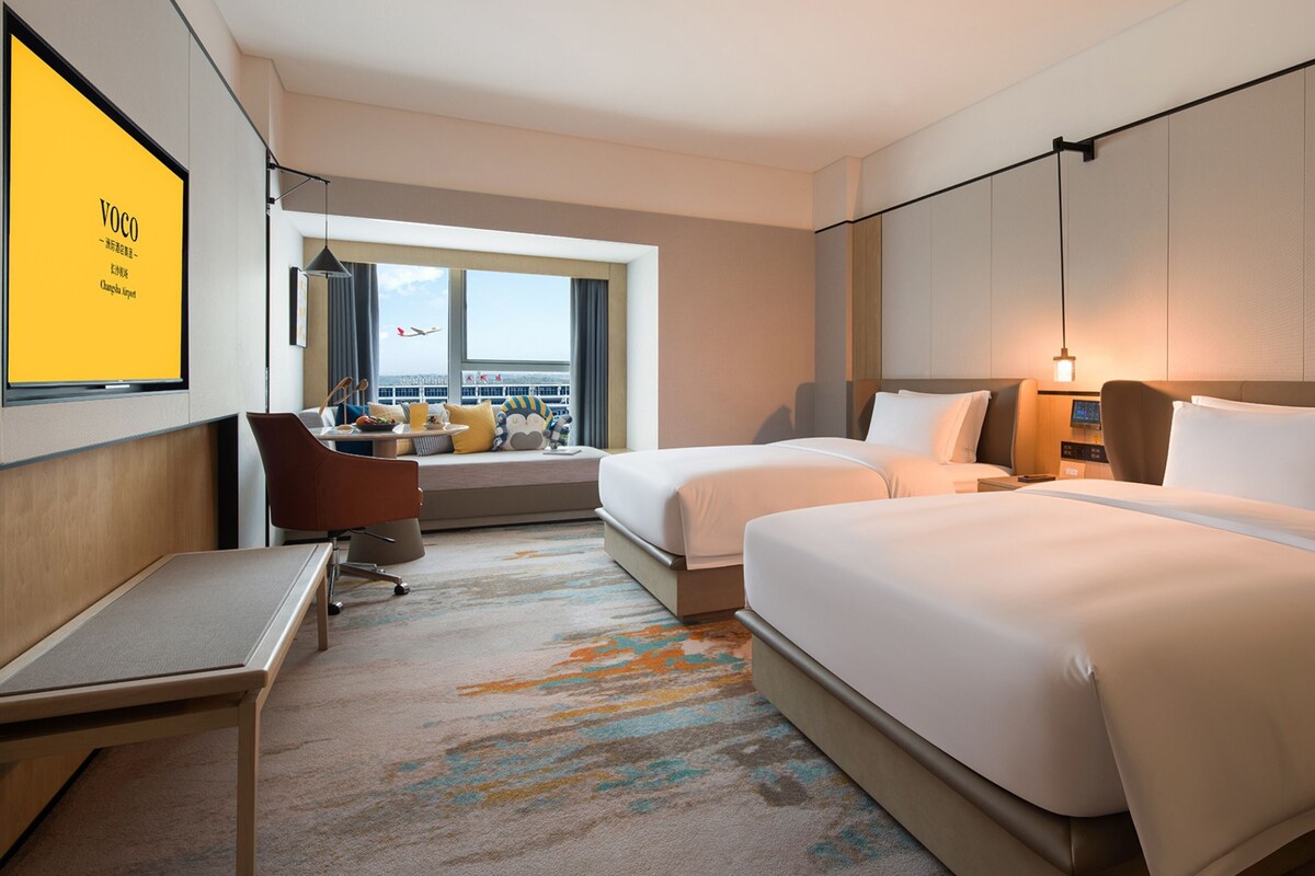 Down duvets, pillow-top beds, desk, blackout curtains