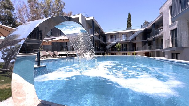 A modern hotel with a pool featuring a water feature. -  ARCADIA OF BODRUM (Bodrum)