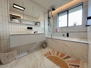 Bathtub, hair dryer, towels