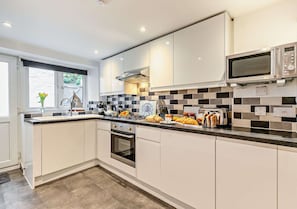 Fridge, microwave, oven, cookware/dishes/utensils