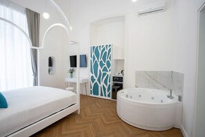 Deluxe Room, 1 King Bed, Hot Tub | Minibar, in-room safe, individually decorated, individually furnished