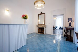 Relax in a spacious room with a fireplace, dining area, and comfortable seating.