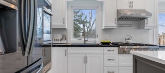 Modern main floor 3-bdrm apartment backing onto a park