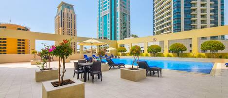 Outdoor pool, pool umbrellas, pool loungers
