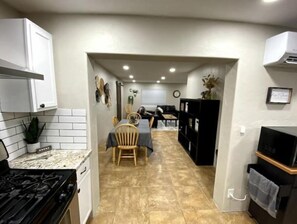 Enjoy a functional kitchen and dining area with a clear pathway between the spaces.