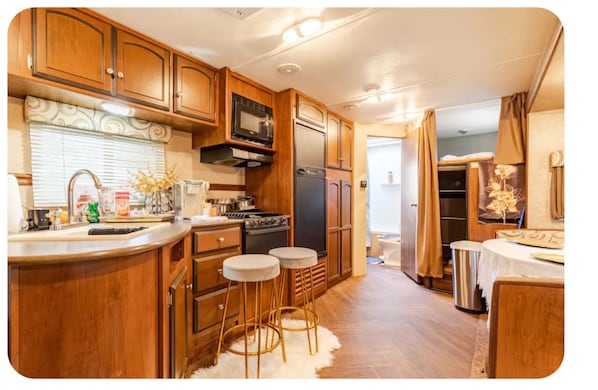 Fridge, stovetop, cookware/dishes/utensils, paper towels