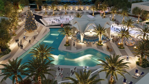 A modern hotel with a central swimming pool, outdoor seating areas, and palm trees. - Fontainebleau Las Vegas, MICHELIN Key Award Hotel (Las Vegas)
