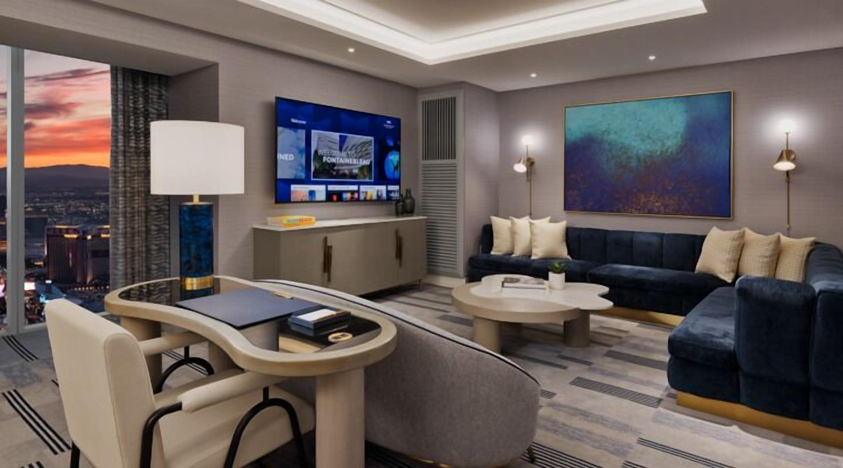 A modern living room with a sofa, coffee table, and TV.