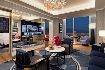 Fleur de Lis Monogram Suite | Living area | 55-inch LED TV with digital channels at Fontainebleau Las Vegas, MICHELIN Key Award Hotel