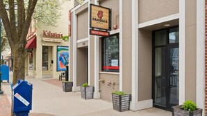 A storefront with a sign for 'Panera's Pizza' and 'Kilwin's' across the street. - Close to Beaches and Downtown (Traverse City)