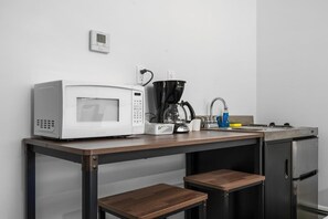Microwave, stovetop, coffee/tea maker, highchair - Peninsula One Apartments Unit 4 (Traverse City)