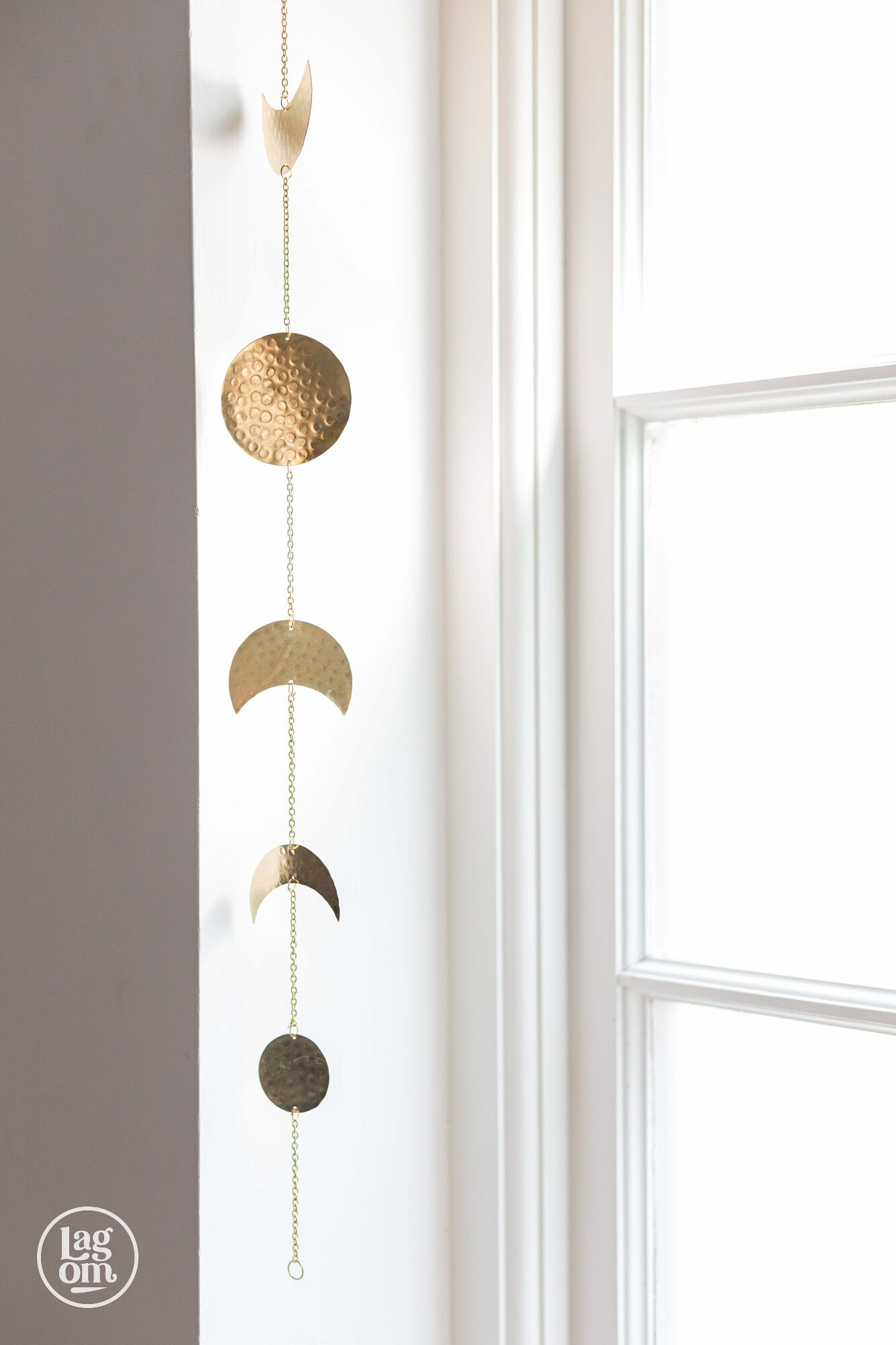 A wall-mounted decorative item with a series of circular elements.