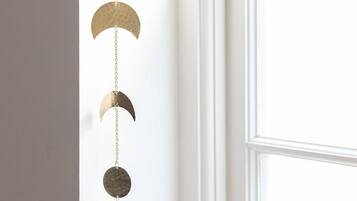 A wall-mounted decorative item with a series of circular elements.