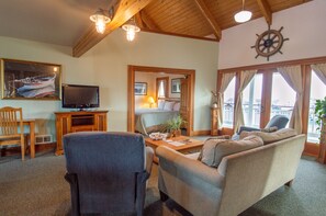 Deluxe Penthouse, Marina View | Living area | 32-inch flat-screen TV with satellite channels - The Swan Hotel (Port Townsend)