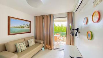 Apartamento conforto | Área de estar | TV 40 polegadas com canais digitais