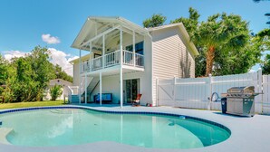 A two-story house with a swimming pool, a covered porch, and a barbecue grill. - Walk to Marina: Home w/ Pool in Palmetto (Palmetto)