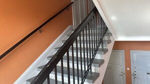 A staircase with black railings and a white wall. - Lovely Apartment in Stockholm City (Stockholm)