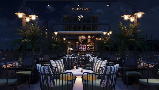 An outdoor seating area with tables and chairs, a bar in the background, and palm trees. - Victor Metropolis Hotel & Rooftop bar (Hanoi)