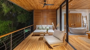 A modern interior with a wooden ceiling, a large window, and a bathtub. - The L Design Villa (Santa Teresa de Cobano)