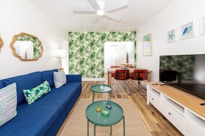Comfort Apartment | Living area | 50-inch flat-screen TV with cable channels, TV, offices