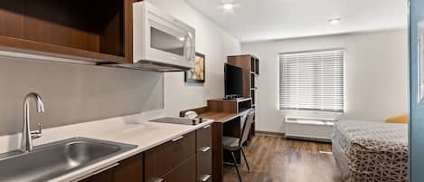 Suite, 1 Queen Bed, Non Smoking | Desk, laptop workspace, free WiFi, bed sheets