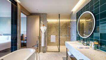Suite, 1 King Bed | Bathroom | Separate bathtub and shower, rainfall showerhead, free toiletries