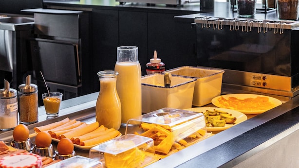 A breakfast buffet with various food items and condiments. - Ibis Marseille Marignane Technopole (Marignane)