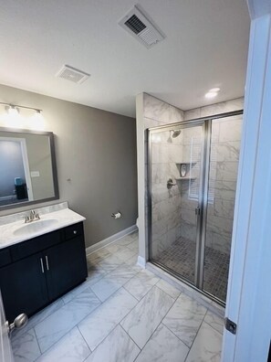 Shower, hair dryer, towels, soap