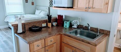 Fridge, coffee/tea maker, cookware/dishes/utensils