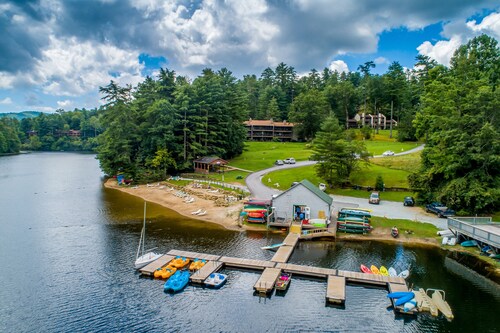 Classic cabin on Hogback Lake with private dock, game room, firepit, & fireplace