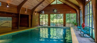 Classic cabin on Hogback Lake with private dock, game room, firepit, & fireplace