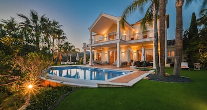 Luxurious southeast-facing villa with 5 bedrooms, heated pool, BBQ, sea views