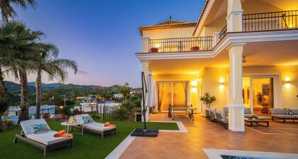 Luxurious southeast-facing villa with 5 bedrooms, heated pool, BBQ, sea views