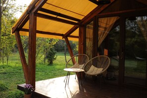 Terrace/patio - Cozy cottage in the middle of green garden, with mountain views. (Ambrolauri)