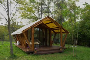 Property grounds - Cozy cottage in the middle of green garden, with mountain views. (Ambrolauri)