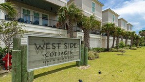 A sign for West Side Cottages at 1592 W. Beach Blvd. - West Side Cottages N 3 Bedroom Home (Gulf Shores)