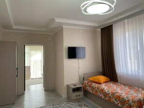 Habitación cuádruple clásica | Zona de estar