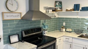 Coffee/tea maker, fridge, microwave, oven